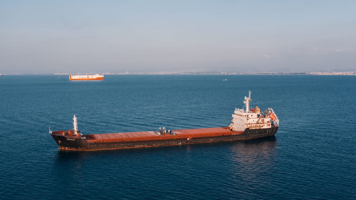 A cargo ship sailing on calm blue sea